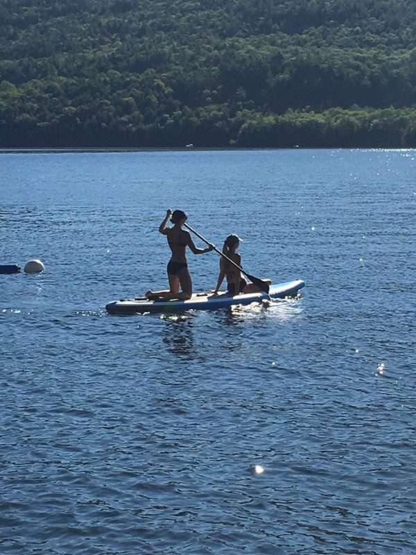 People paddle boarding on a lake